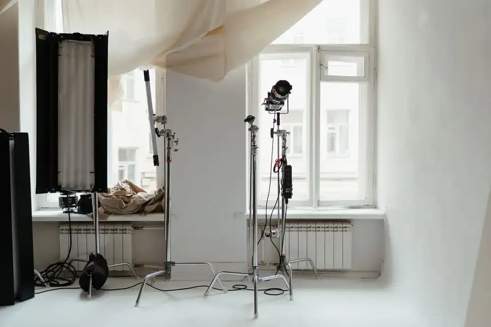 C-stands and grip equipment in the studio workspace